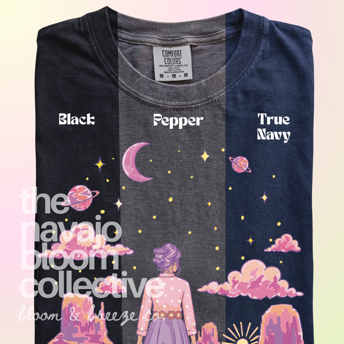 Starry Eyed Dreamer woman, desert mesas, moon, and planets design on a Comfort Colors tee, comparing Black, Pepper, and True Navy.