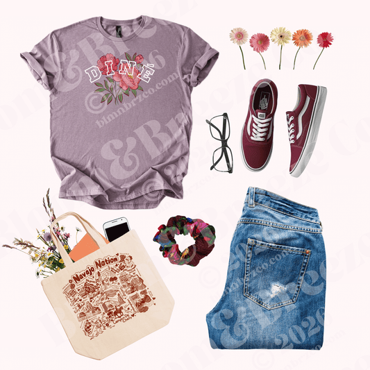 Collage of a purple t-shirt with floral design, jeans, maroon sneakers, tote bag, scrunchie, and sunglasses on a white background.