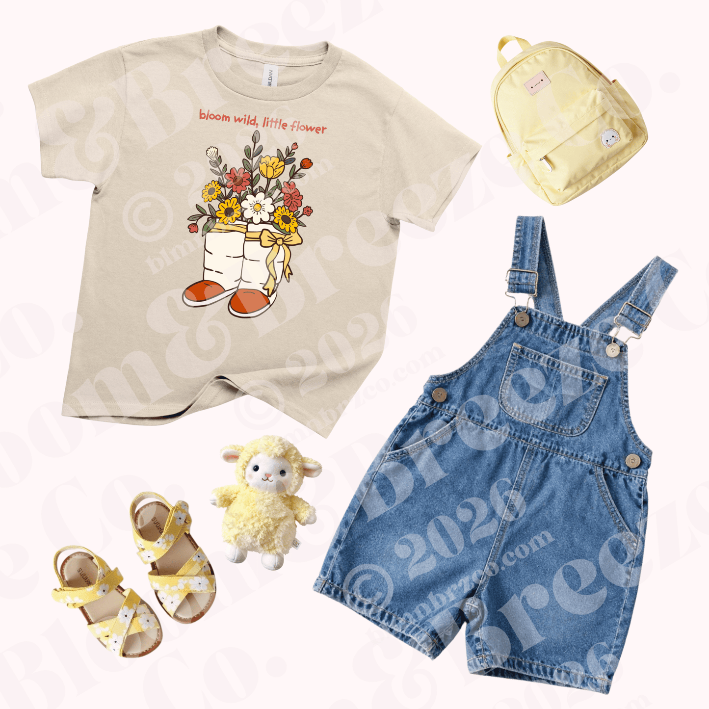 Youth Dune Bloom ‘Bloom Wild, Little Flower’ graphic t-shirt styled with denim overalls, yellow sandals, and matching backpack.