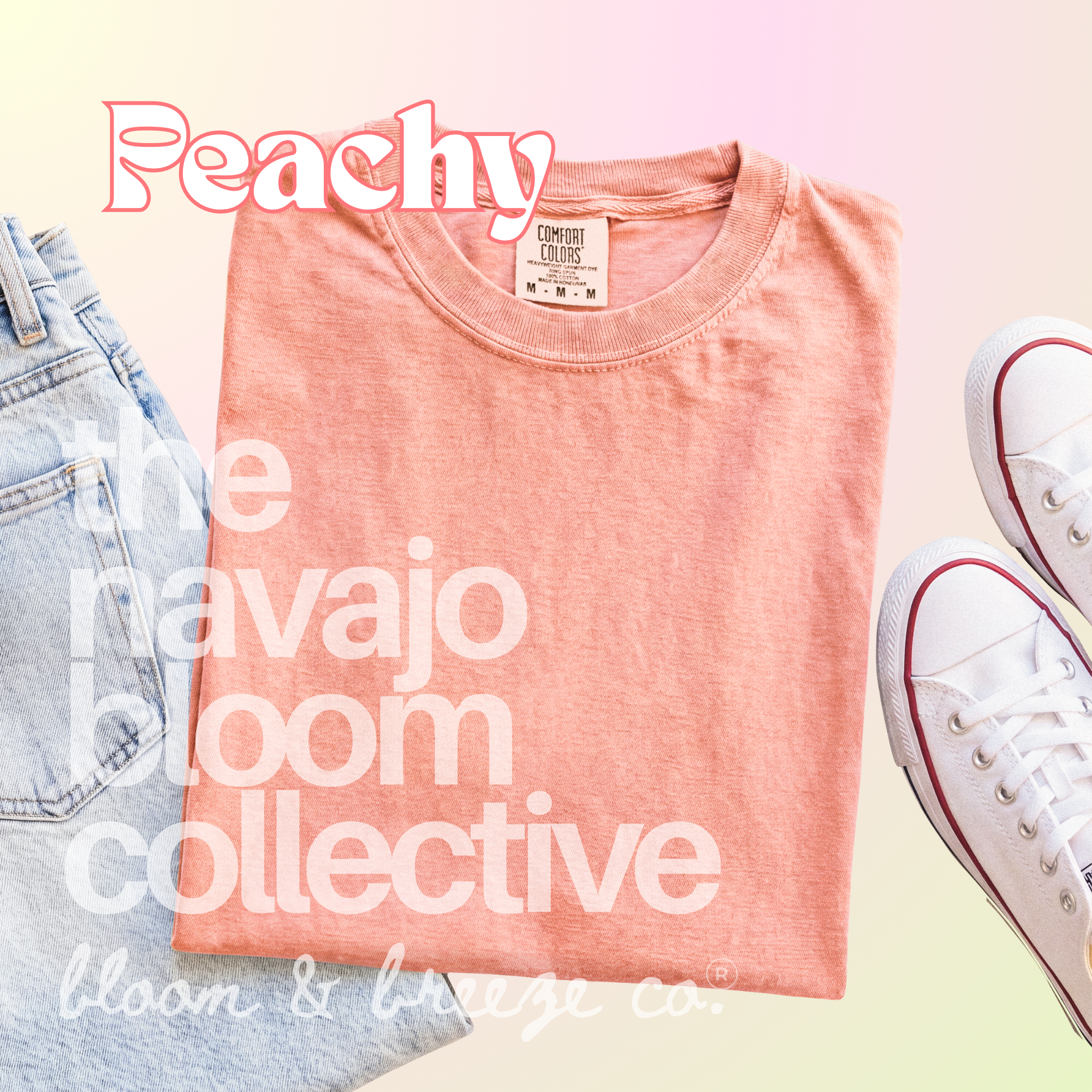 Peachy colored comfort colors flatlay with jeans and sneakers