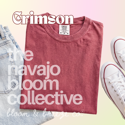 Faded red colored comfort colors flatlay with jeans and sneakers