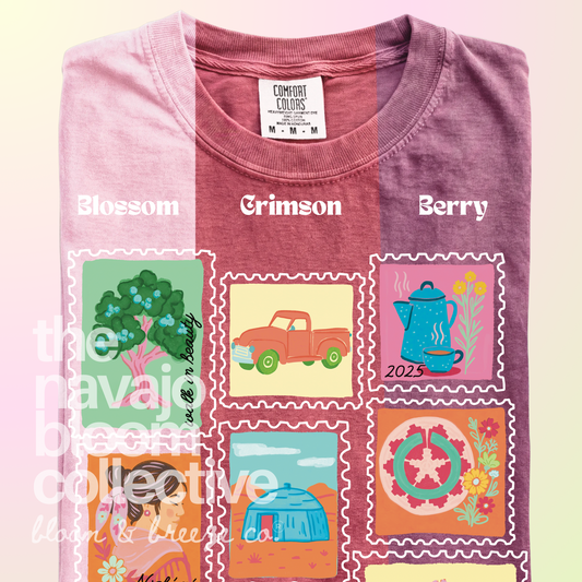 Dear Nizhóní stamp-style artwork on a folded Comfort Colors tee, comparing pale pink, Crimson, and muted berry shades .