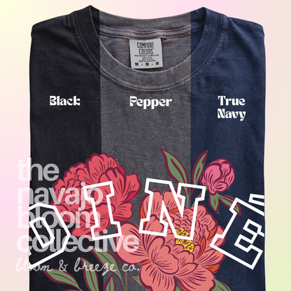 Diné Blossom floral tee in Black, Pepper, and True Navy.