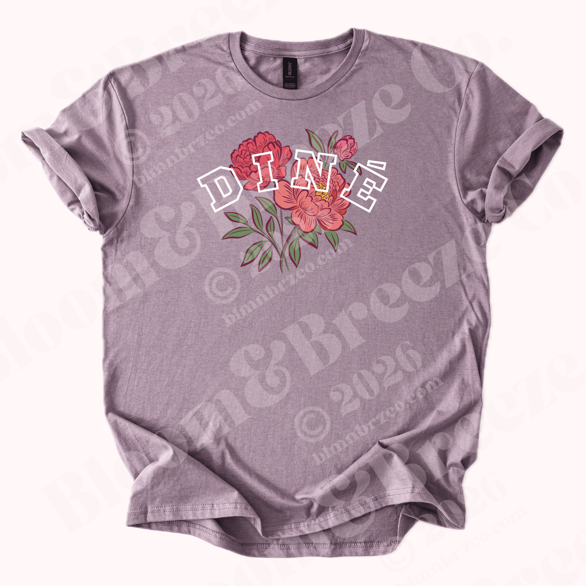 Light Purple t-shirt with floral design and text “Diné” on a white background