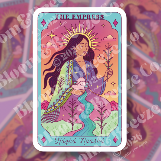 The Empress tarot-inspired sticker showing an Indigenous woman with long flowing hair, sunburst halo, traditional-inspired clothing, plants, mountains, river, and the phrase ‘Hózhó Naashá’ beneath her