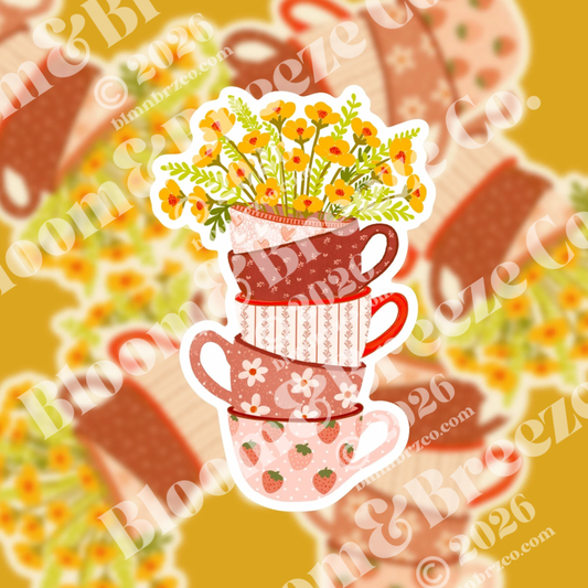 Four stacked vintage-style teacups in warm pink and brown tones, filled with bright yellow wildflowers.