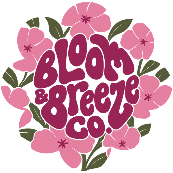 Floral logo with funky text reading bloom & Breeze co in dark pink color