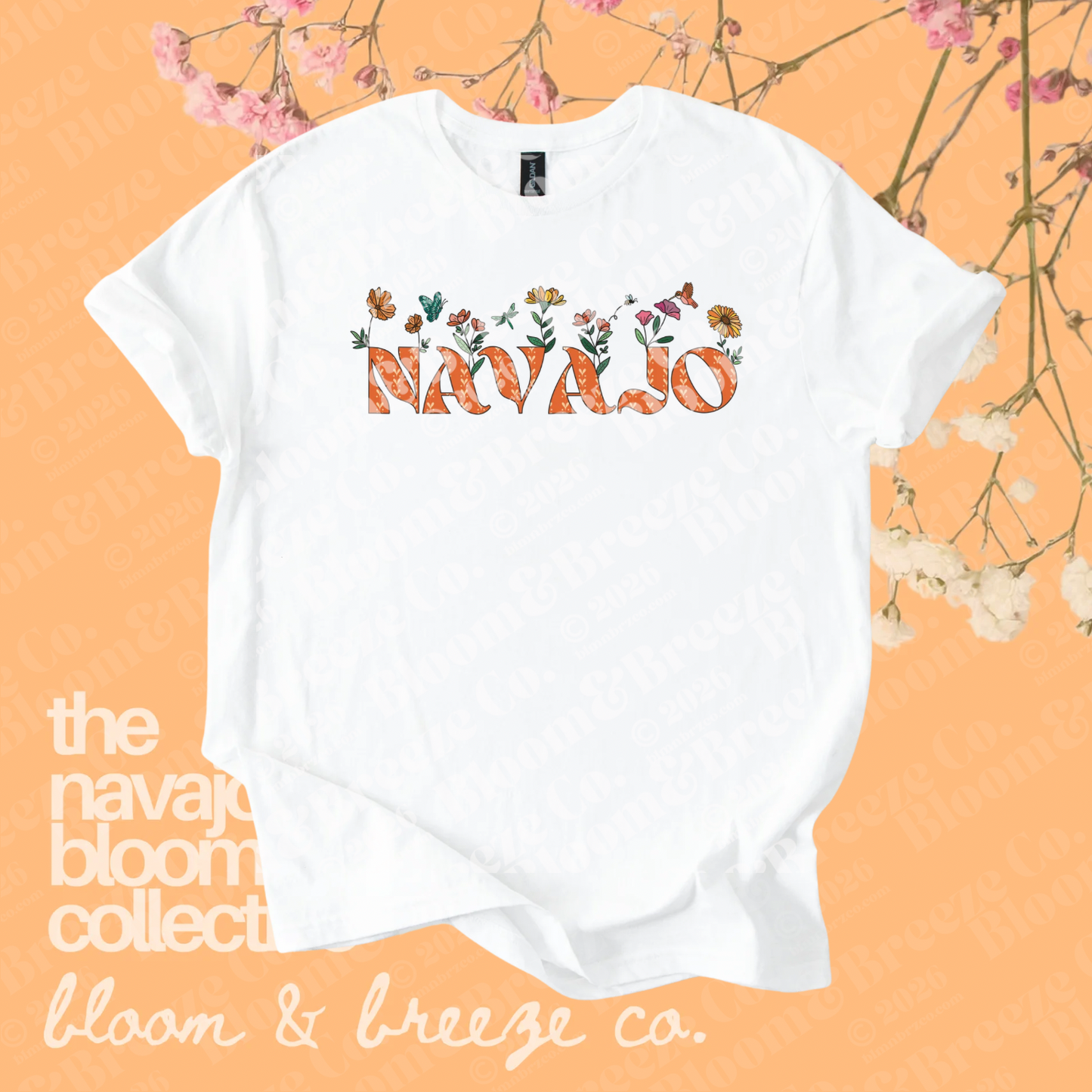 White Navajo floral graphic tee with orange lettering on a soft orange floral background.