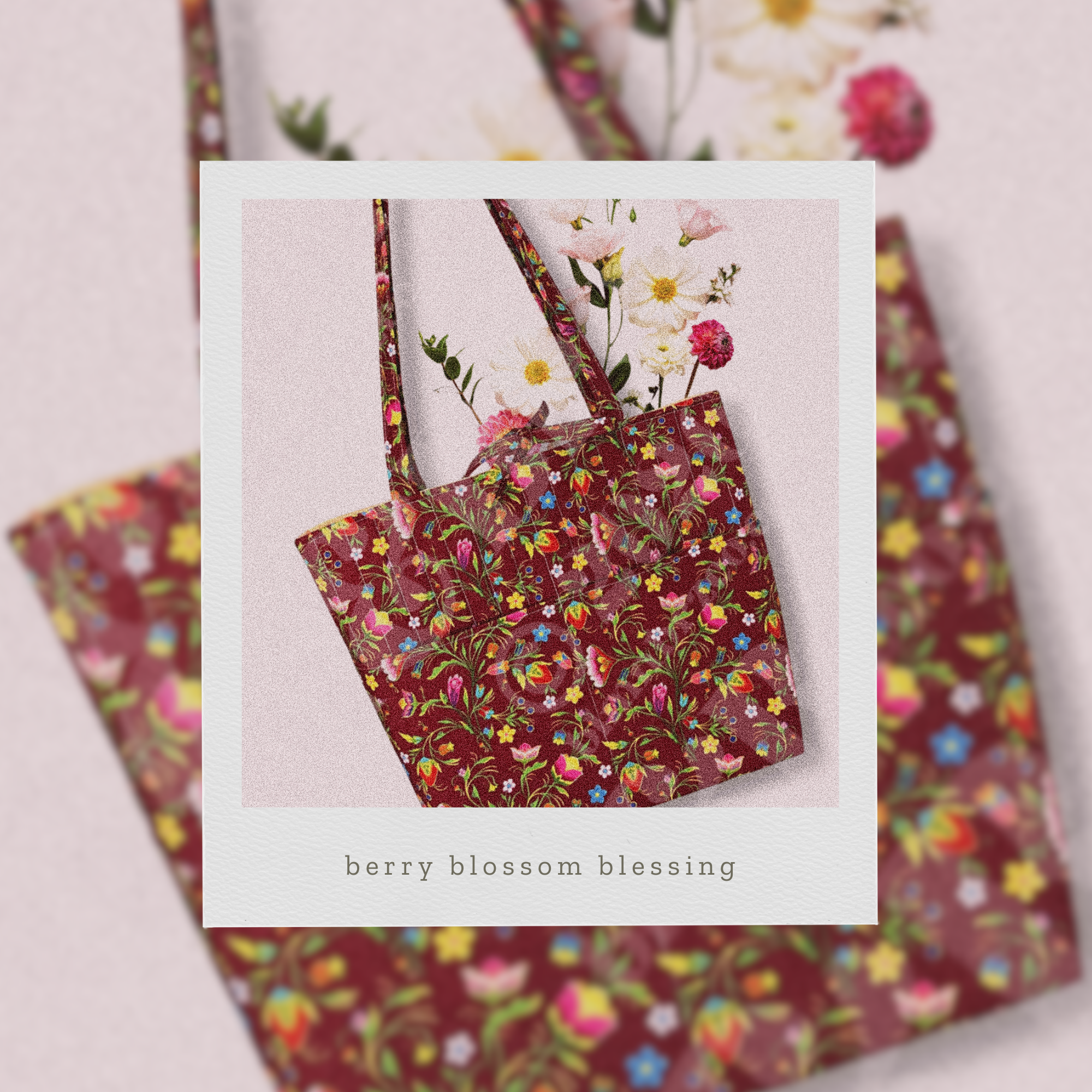 Floral patterned bag with 'berry blossom blessing' text on a light background