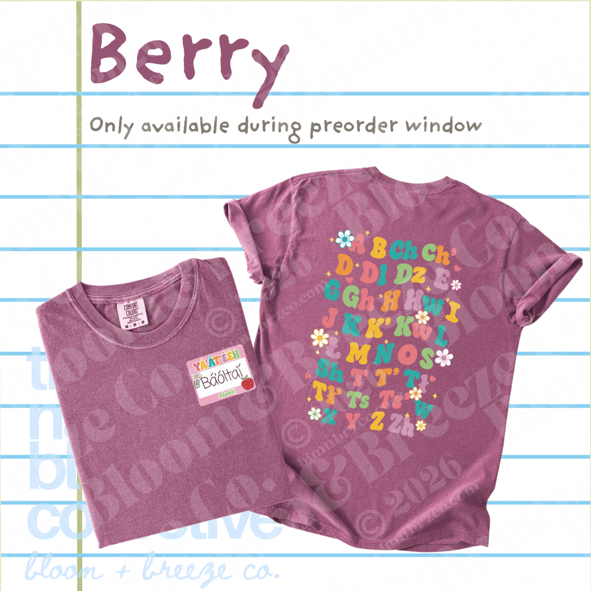 A folded and laid-flat berry purple t-shirt from Bloom + Breeze Co. on a lined paper background.