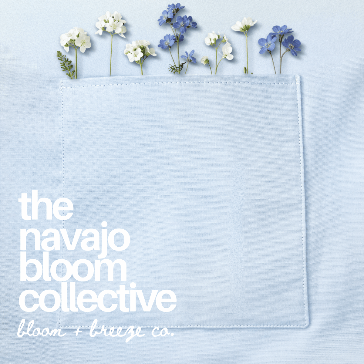 Close-up of a pale blue pocket decorated with delicate pink and white flowers, featuring “The Navajo Bloom Collective” branding.