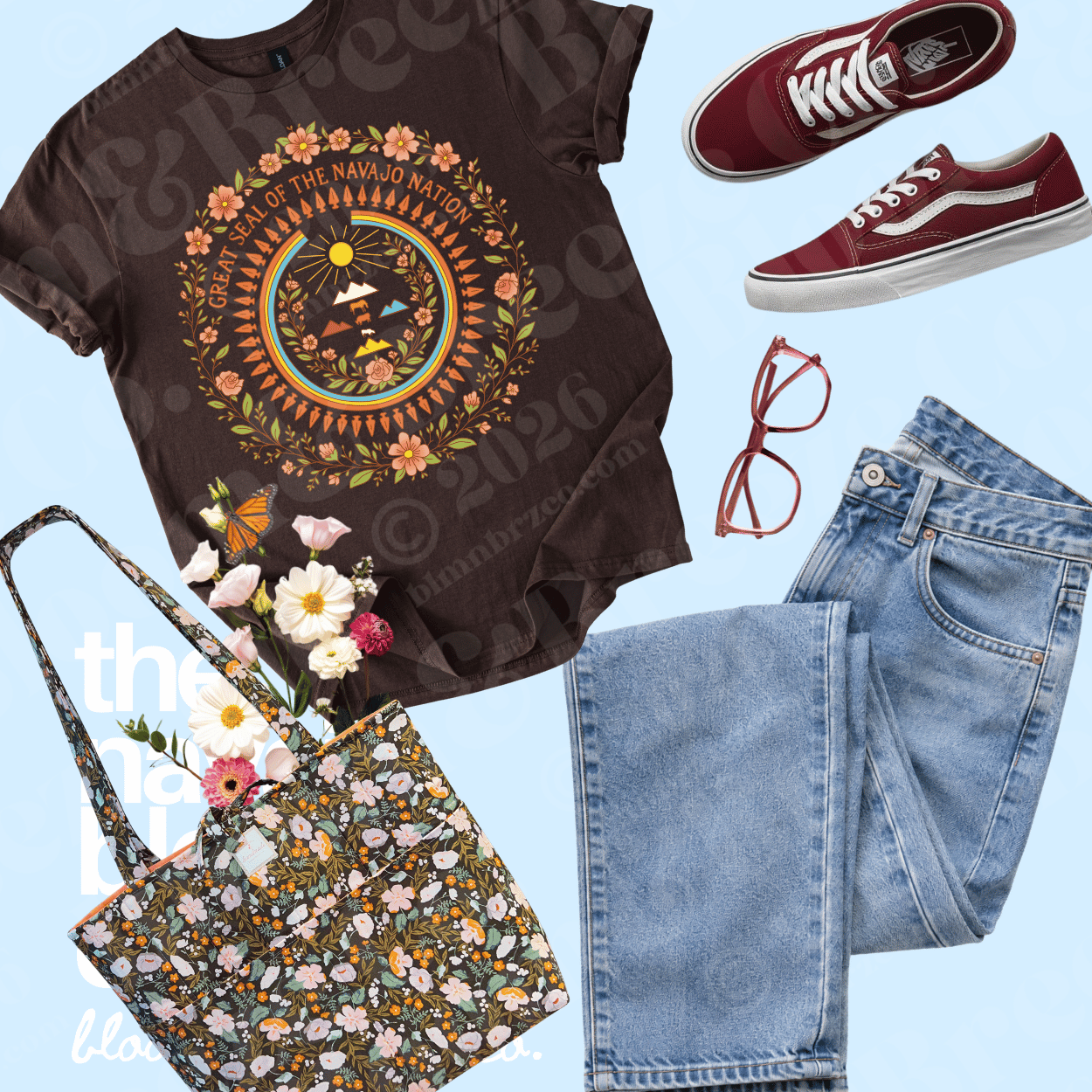 A styled flat-lay outfit featuring a dark brown graphic t-shirt with a colorful circular design, light-wash blue jeans, burgundy Vans sneakers, a floral tote bag, and red-framed glasses on a light blue background.