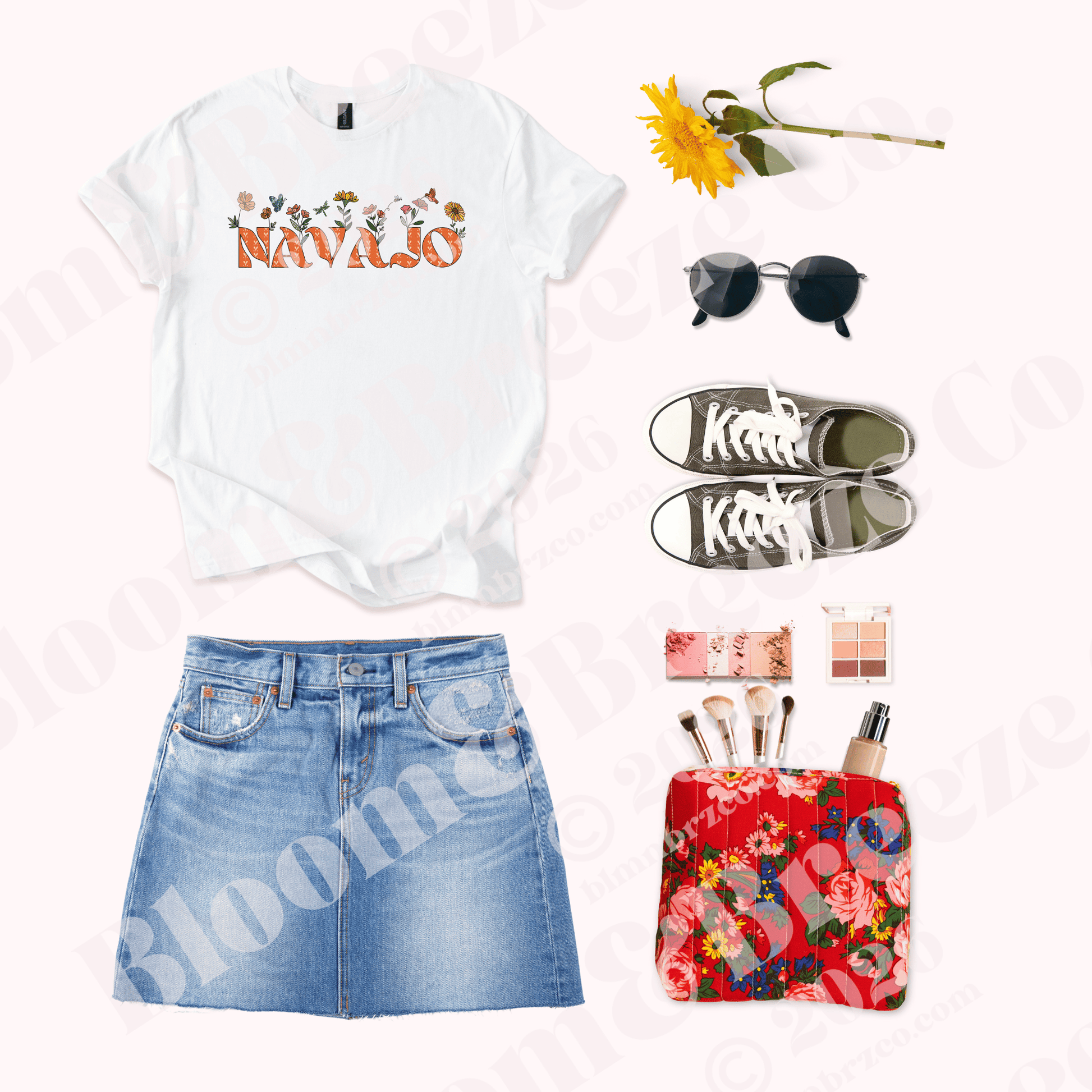 White t-shirt with 'Navajo' design, denim skirt, floral pouch, sunglasses, and makeup items on a white background.
