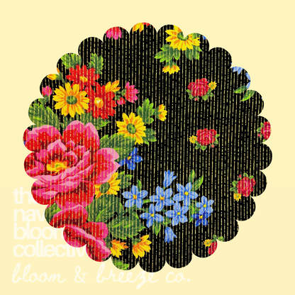 Black fabric swatch with bright pink, red, yellow, blue, and green floral print with gold stripe details on a pale yellow background.