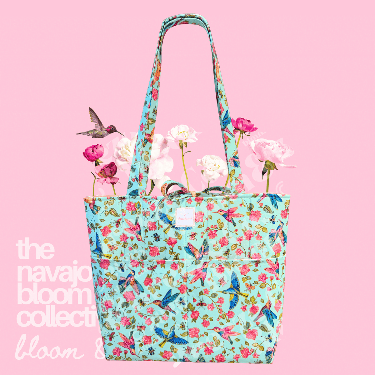 Floral tote bag with flowers on a pink background, featuring 'the navajo bloom collective’.