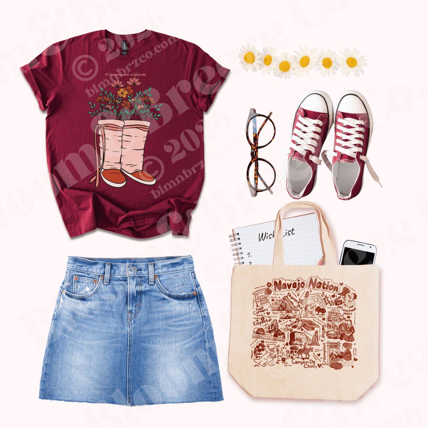 Maroon t-shirt with floral Moccasin design, blue jeans, orange sneakers, glasses, and a tote bag on a white background.