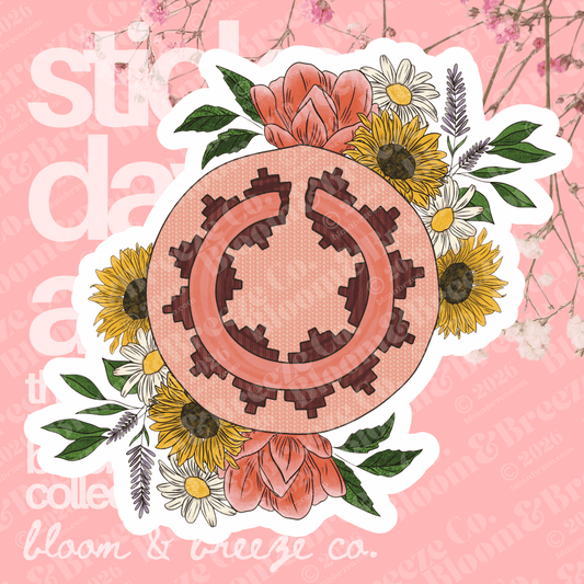 Navajo basket with wildflowers on opposite sides of each other